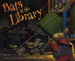 a number of bats pulling a book off library shelves using headphone cord